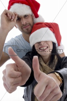 young couple with chritsmas hat 