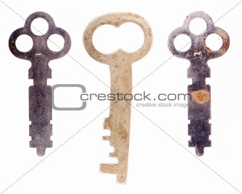 Three odd old keys isolated on a white background