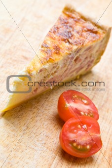 Bacon quiche with a tomato