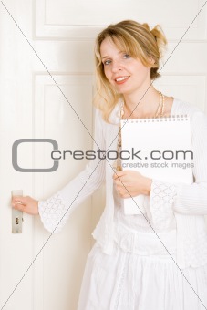 A woman opening a door
