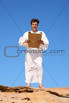 Man in robe reading 