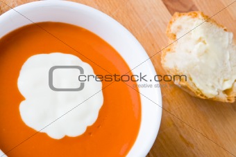 Tomato soup with cream and bread
