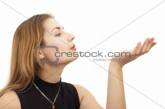 blond girl blowing something away from palm