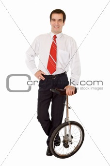 Balance in business - businessman with monocycle