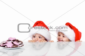 Two kids yearning for the christmas cookies
