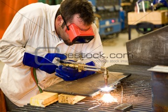 Worker in Metal Factory