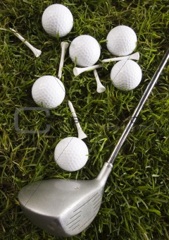 Golf club with ball on a tee & drive
