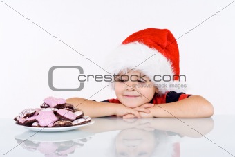 Boy admiring the christmas gingerbread cookies