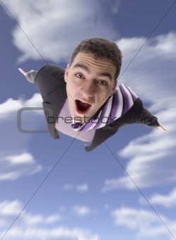 Winged businessman flying through the sky