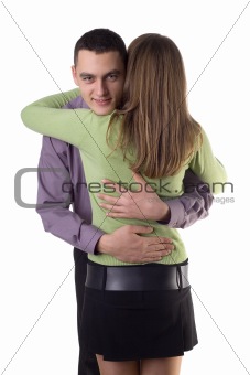Cuddling couple - man's face to the camera.
