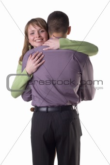 Cuddling couple - woman's face to the camera.