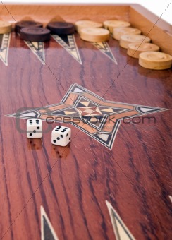 Wooden handmade backgammon board isolated on white
