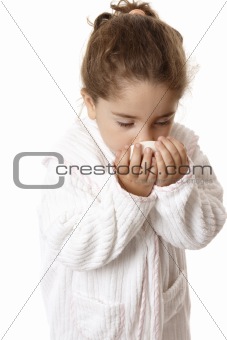 Little girl sniffing fragrant soap