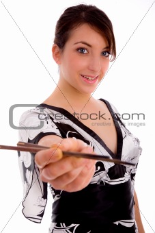 front view of smiling woman holding chopsticks