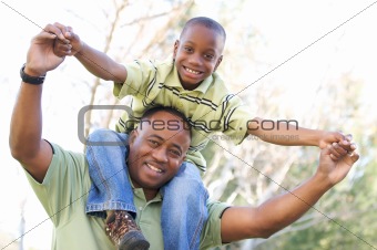 Man and Child Having fun in the park.