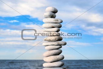 Grey stone tower on a beach