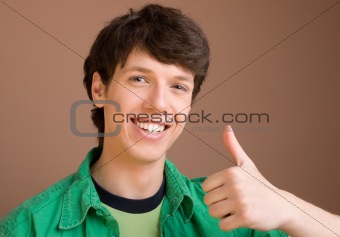 Young man giving a thumbs up