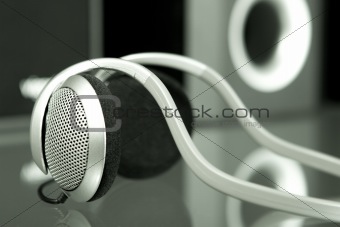 Audio head-phones with speakers at the background