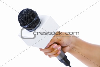 Bare hand holding microphone