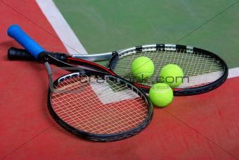 Tennis rackets, balls and court