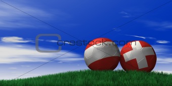 Austria and Switzerland soccer ball on grassand sky background