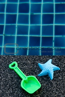 Plastic starfish and spade