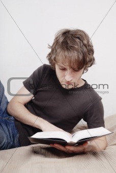 The man reads the book