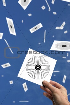 hand with target or goal against blue sky