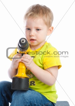 Little boy with screwdriver
