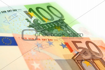 a few euro bills on a white background