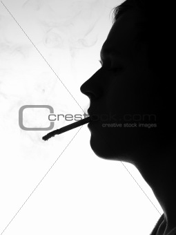 Silhouette of a man smoking