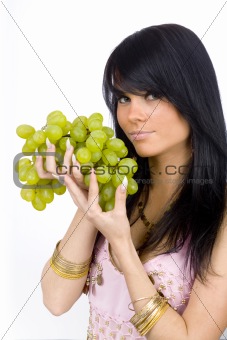 brunette with green grapes