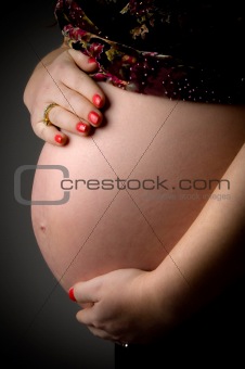 close view of tummy of pregnant woman