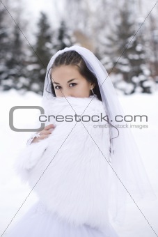 Bride is in the winter forest