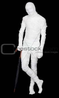 Man in costume mummy and umbrella