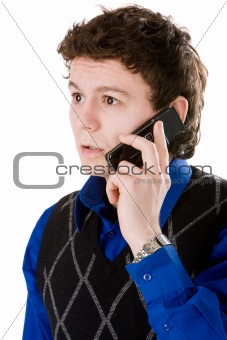 Surprised man talking with mobile phone isolated on white