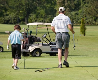 Father and Son Playing Golf