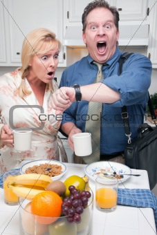Late for Work Stressed Couple Checking Time in Kitchen.