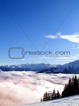 A cloud in the mountain valley in sunset