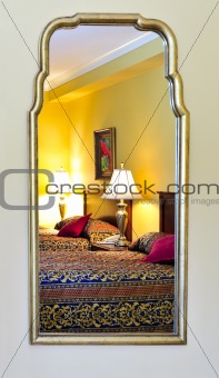 Bedroom interior reflected in mirror