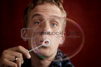 Young Man Blowing a Bubble