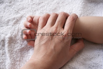 Mother's & kid's hand