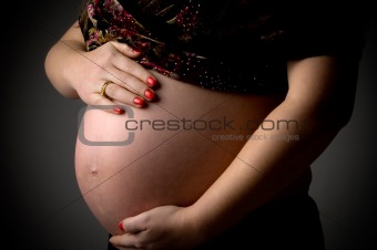 close view of tummy of pregnant woman