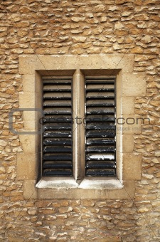 Slatted window in sandstone blocks