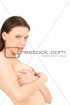 Young woman hiding her breasts