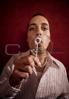 Young Man Blowing a Bubble