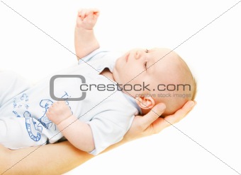 baby on parent's hands over white