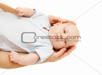 baby in parent's hands over white