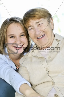 Granddaughter hugging grandmother