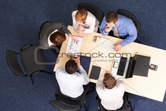 five business people meeting